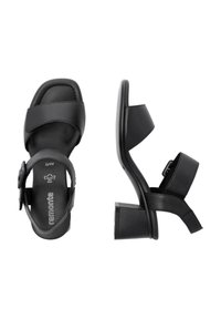 Black leather heeled sandals with two wide straps, an adjustable ankle strap, and a block heel for stability. Soft inner lining for comfort.