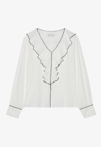 Blouse blanche à manches longues avec un col en V à volants, bordure noire, texture douce et fermeture à boutons sur le devant lisse.