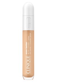 Clinique Even Better Concealer in einer beigefarbenen Tube mit einer runden weißen Kappe. Der Text auf der Verpackung enthält Produktdetails in weißer Schrift.