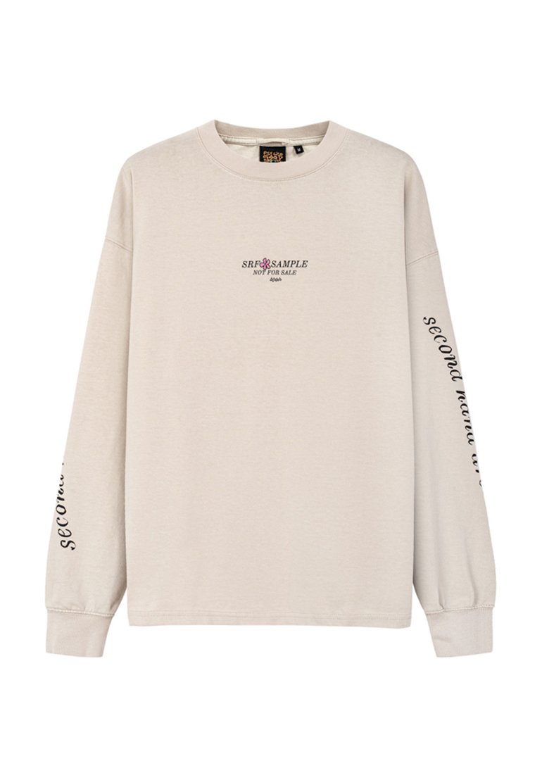 Beżowa długorękawowa bluza z bawełny, z czarnym i różowym logo tekstowym z przodu oraz napisem "second hand" na prawej rękawie.