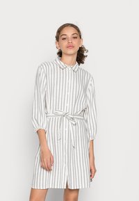 Striped shirt dress in light gray and white, made of a lightweight fabric, featuring a collar, button front, and a tied waist belt.