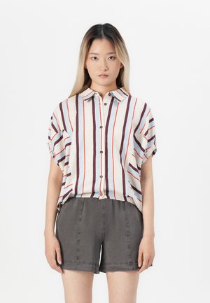 Short-sleeve, collared shirt with red, brown, and light blue vertical stripes; features button closure and relaxed fit; paired with gray shorts.
