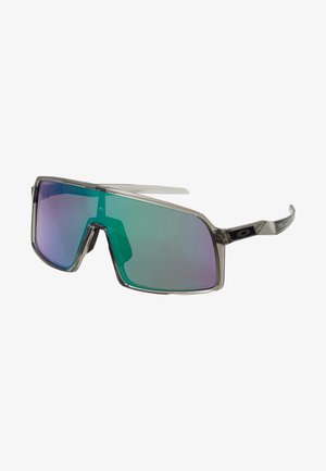 Napszemüveg téglalap alakú, szürke áttetsző kerettel és tükörlencsékkel, amelyek zöldről lilára fokozatosan színeződnek. A logó a szár oldalán található.