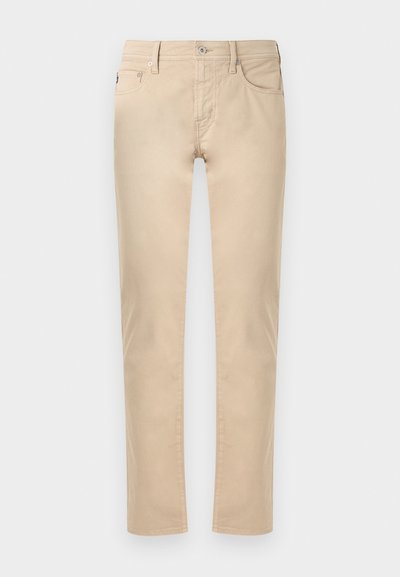Μπεζ παντελόνι casual, σε στενή γραμμή, με μπροστινό κούμπωμα με κουμπί και φερμουάρ, θηλιές για ζώνη και τσέπες στο πλάι και πίσω.