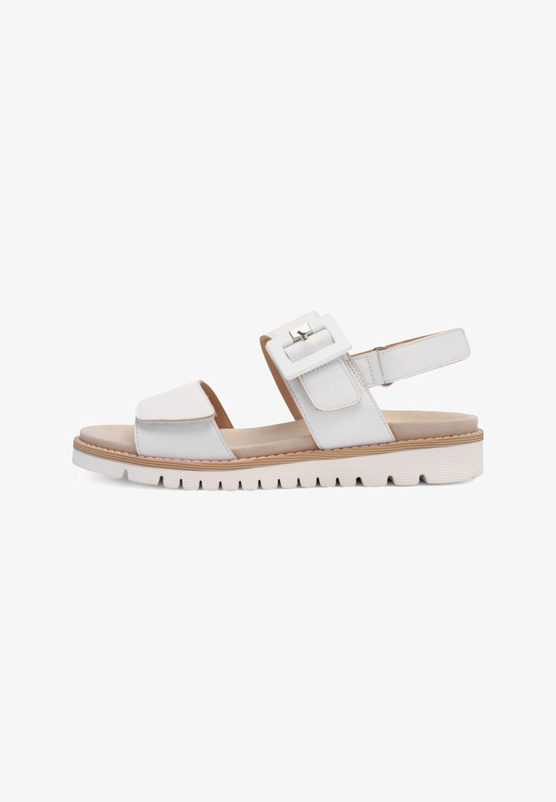 White open-toe sandal with wide straps, a large square buckle, adjustable heel strap, and a cushioned grooved sole.