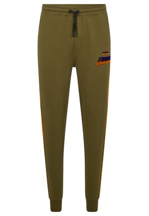 Pantalon de jogging vert olive avec des bandes latérales orange, taille avec cordon noir et un petit logo violet-orange sur la partie supérieure de la cuisse gauche.
