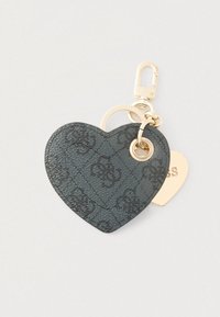 Sort hjerteformet nøglering lavet af tekstureret syntetisk materiale med et diskret mønster og guldfarvede hardware-detaljer.