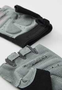 Gray cycling gloves featuring a suede-like texture, mesh accents, and a black wrist strap. Logo "ENDURA HUMMVEE PLUS" displayed on fabric.