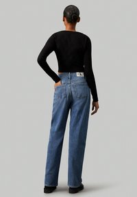 Calvin Klein Jeans HIGH RISE  - Brīva piegriezuma džinsi - denim medium