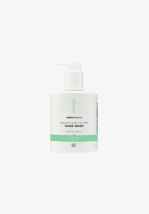 Weiße Plastikflasche mit Pumpspender, beschriftet mit "Green People Manuka & Lemon Tea Tree Hand Wash", mit grünen Akzenten und Text.