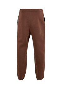 Brune sweatpants med elastisk talje og sidelommer. Fremstillet af blødt stof, med en afslappet pasform og tapered ben-design.