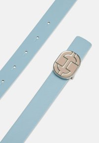 Light blue leather strap with silver hardware and a beige decorative buckle featuring an interlocking design. Adjustable with multiple holes.