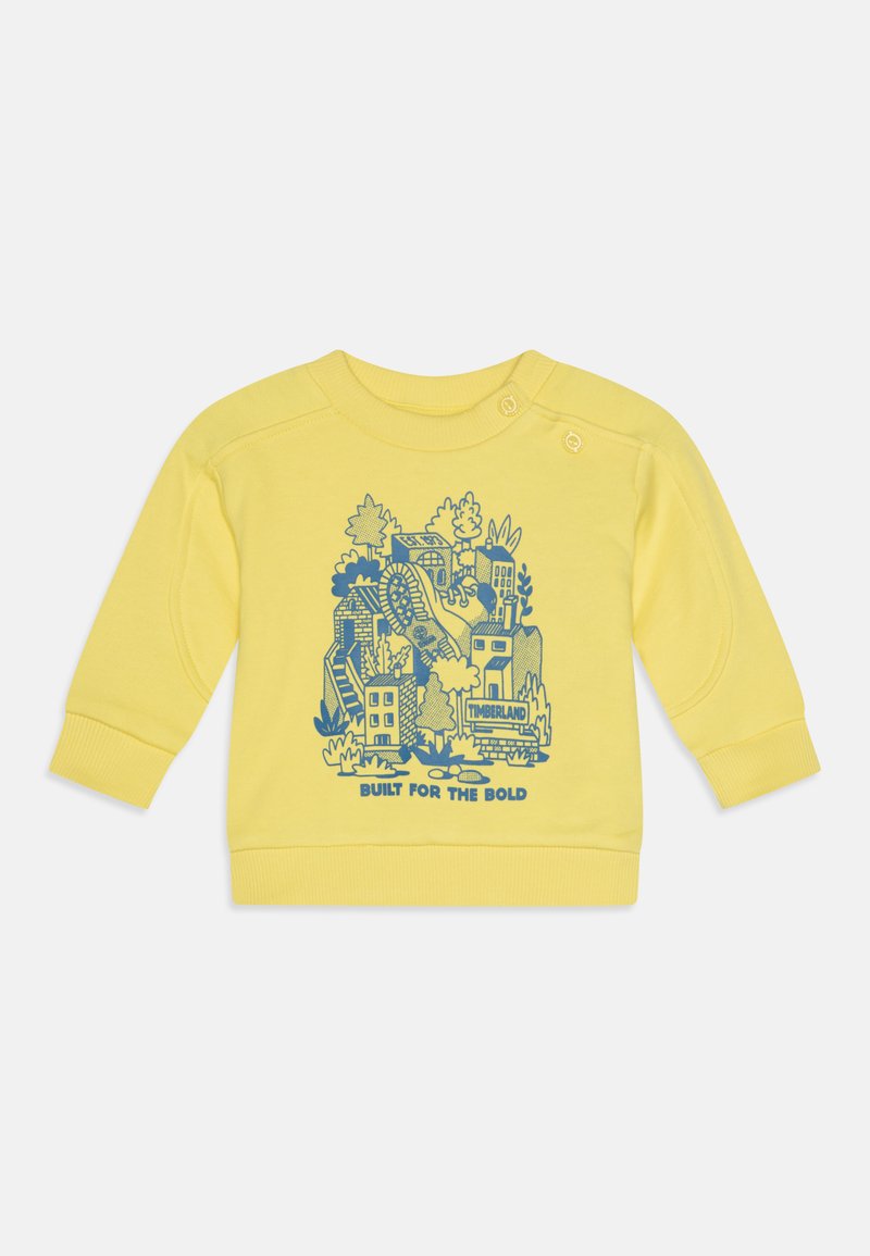 Κίτρινη μπλούζα από μείγμα βαμβακιού με μπλε γραφικό σχέδιο που απεικονίζει κτίρια και φύση; ριμπ μπούστο και μανσέτες; κλείσιμο με κουμπιά.