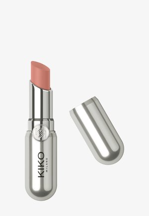 KIKO Milano lipstick in a silver metal casing with a rounded design. The bullet is a soft peach color. Cap is slightly raised beside the tube.