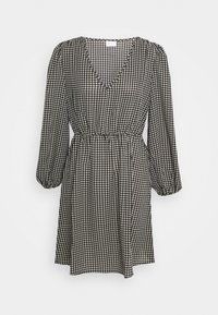 Svart och vit houndstooth-mönstrad klänning med V-ringning, långa puffärmar och elastisk midja, som har en avslappnad silhuett.