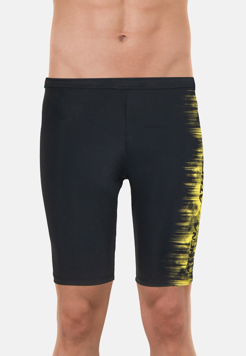 Shorts de bain noirs avec un dégradé jaune sur le côté, fabriqués en tissu extensible et à séchage rapide, conçus pour le confort et la flexibilité.