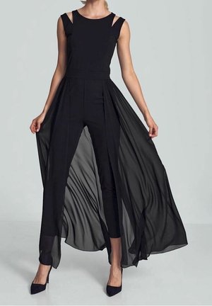 Black jumpsuit with sheer, flowing overlay. Fitted bodice, wide pants, and decorative straps. Smooth texture and lightweight material.
