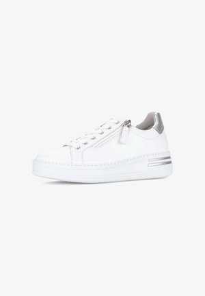 White low-top sneaker with laces, side zipper, silver heel patch, and double silver stripes on the white sole.