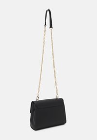 Black rectangular handbag with a flap closure, gold chain shoulder strap, and a black leather shoulder pad.