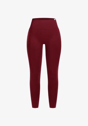 Leggings bordeaux a vita alta realizzati in materiale elasticizzato, caratterizzati da un design morbido e senza cuciture e una vestibilità a lunghezza totale. Nessun logo o motivo visibile.