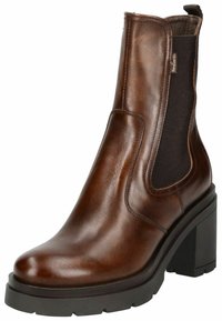 Bottine en cuir marron avec des panneaux latéraux élastiques, bout rond et talon épais noir. Texture lisse avec un léger éclat. Design classique.