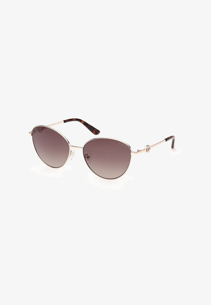 Ochelari de soare cu ramă metalică, lentile rotunde cu gradient maro și vârfuri ale brațelor cu model piele de țestoasă, pe un fundal alb.