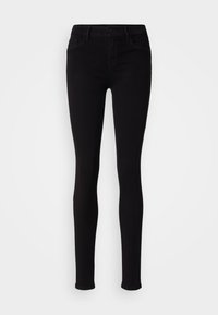 Jean skinny noir avec bouton à l'avant et poches, taille haute avec passants pour ceinture, présenté sur un fond blanc uni.