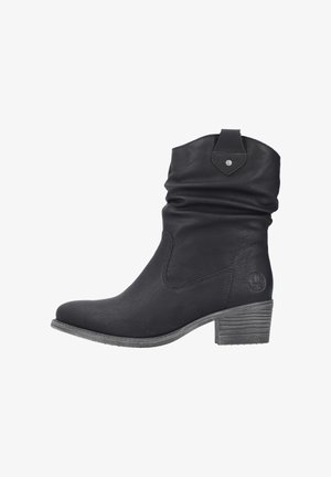Bottines en cuir noir avec un design affaissé, bout rond et un talon gris texturé. Présentent un accent en argent à l'arrière.