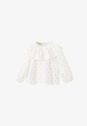 Weiße Bluse mit langen Ärmeln, einem Rüschensaum am Ausschnitt und floraler Stickerei. Hergestellt aus leichtem Stoff, mit lockerem Schnitt und elastischen Bündchen.