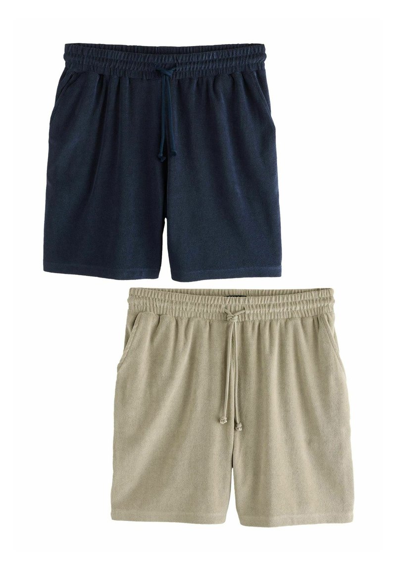 Shorts en coton bleu marine et beige clair avec taille élastique, cordon de serrage et poches latérales ; texture douce, design décontracté et longueur mi-cuisse.