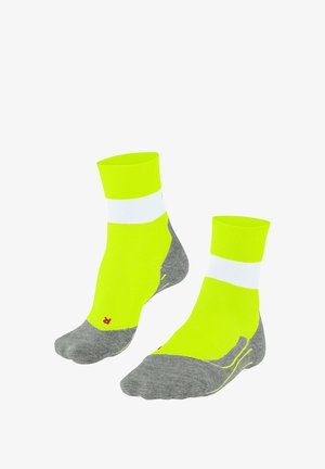 Bright neon yellow ankle socks with white stripes and gray soles, displayed together against a white background.