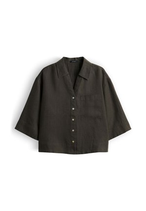 Chemise courte vert olive foncé à boutons, manches larges, col et poche poitrine côté gauche.