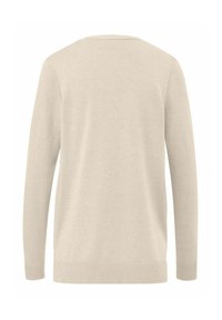 Beige trui met lange mouwen, ronde hals en geribbelde manchetten. Gemaakt van zacht materiaal, met een effen textuur zonder patronen.