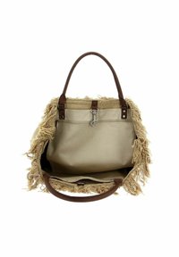 Kraví béžová taška s třásněmi, hnědými koženými uchy a vnitřní kapsou. Design obsahuje prostorné otevírání a měkkou texturu.