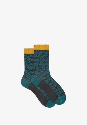 Calze in misto cotone con un motivo floreale teal su sfondo nero, con polsini a coste arancioni e punta teal a contrasto.