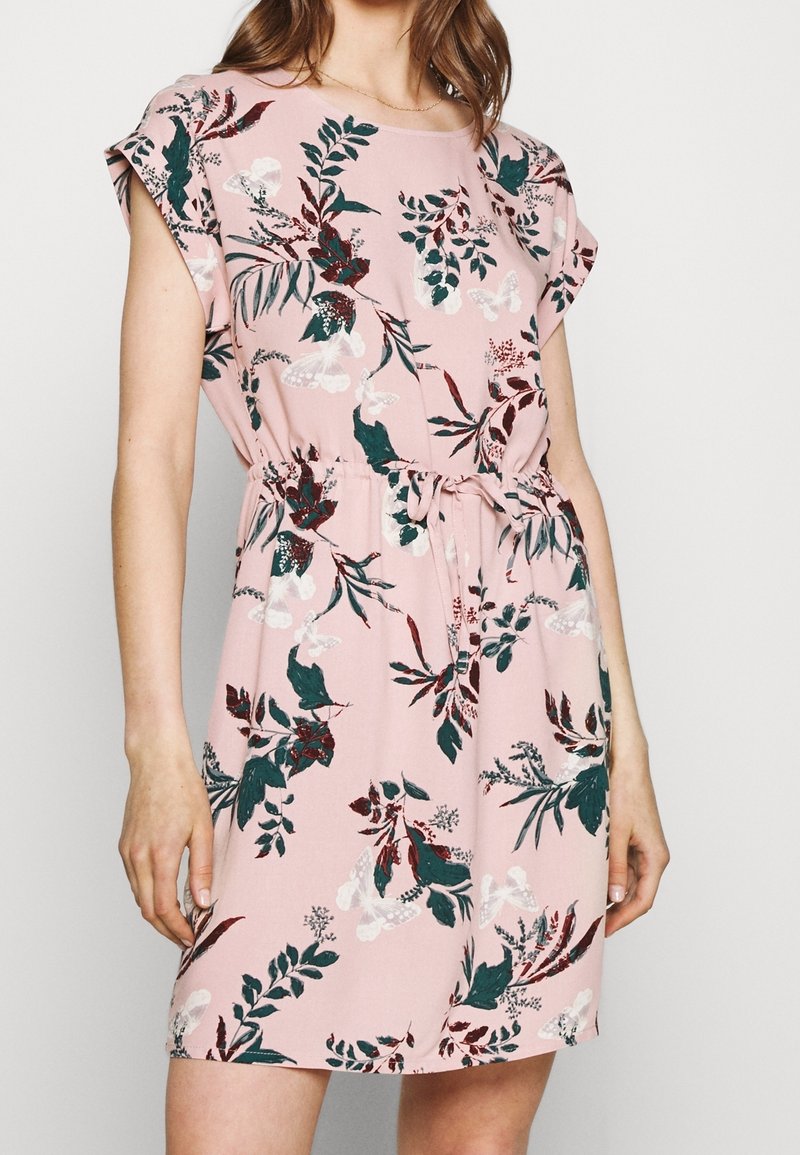 Floral dress with a pink background, featuring green and burgundy leaves and white butterflies. Short sleeves and an adjustable waist tie.