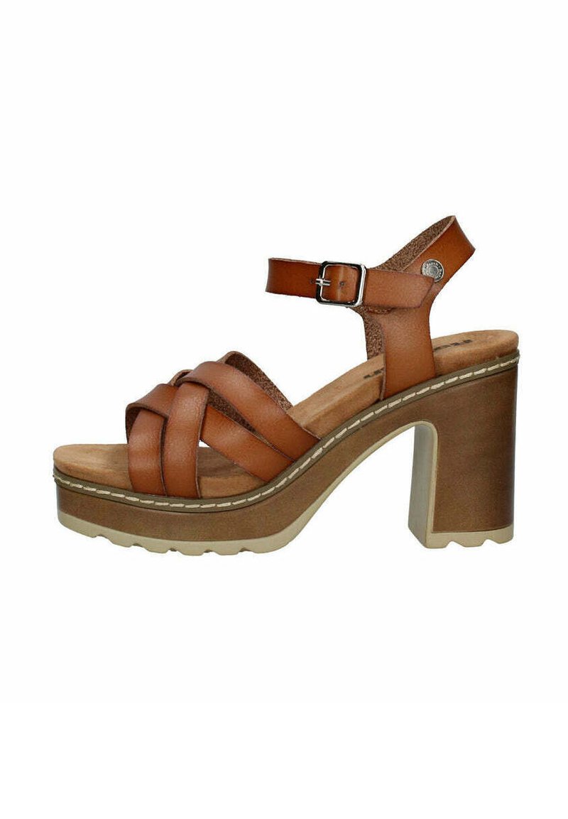 Sandalias de plataforma de cuero marrón con tiras entrecruzadas, hebilla ajustable en el tobillo, tacón bloque y suela texturizada.