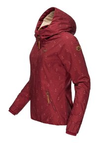 Red jacket with anchor print, hood, and zippered pockets. Features elastic cuffs, a smooth texture, and tan accents.