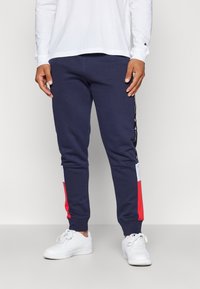 Champion RETRO SPORT CUFF PANTS - Pantalones deportivos - dark blue