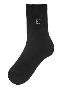 Black cotton crew sock with ribbed cuff, featuring a small white logo near the top. Smooth texture and classic shape.