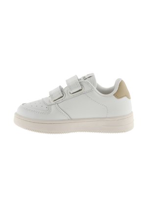 White leather sneaker with two adjustable Velcro straps, rounded toe, perforated detailing, and a beige accent on the heel. Rubber sole.