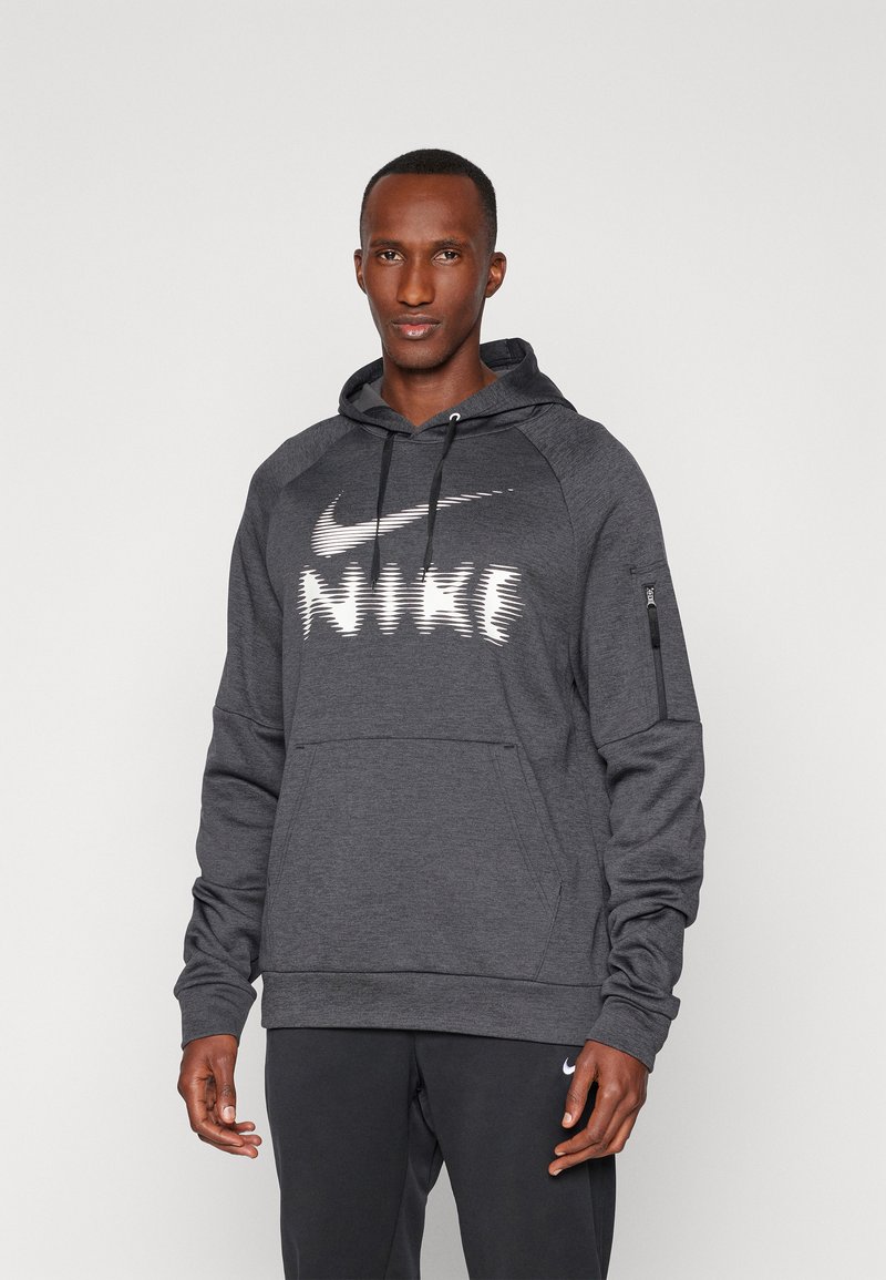 Tmavošedá mikina Nike s predným klokaním vreckom, bielym logom, kapucňou so šnúrkou a zipsovým vreckom na rukáve na ukladanie vecí.