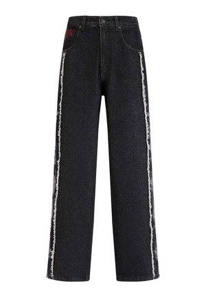 Wide-leg black denim jeans featuring frayed white side stripes and a small red embroidered detail on the front pocket.