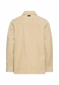 Beige corduroy shirtjack met een kraag, lange mouwen en verticale ribbeltextuur. Achteraanzicht zonder zichtbare logo's of versieringen.