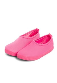 Pink slip-on shoes made of smooth material; rounded toe, elastic edges, and textured rubber soles for grip; minimalist design.