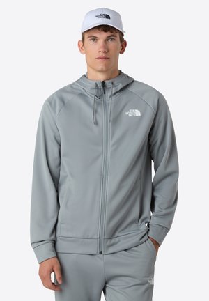 Grijze zip-up hoodie met een gestructureerde afwerking, voorzien van een capuchon, zijzakken en het witte The North Face-logo op de linkerborst.