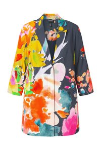 Long blazer avec manches 3/4 présentant un motif floral abstrait audacieux et coloré en orange, rose, jaune, vert et bleu sur fond sombre.