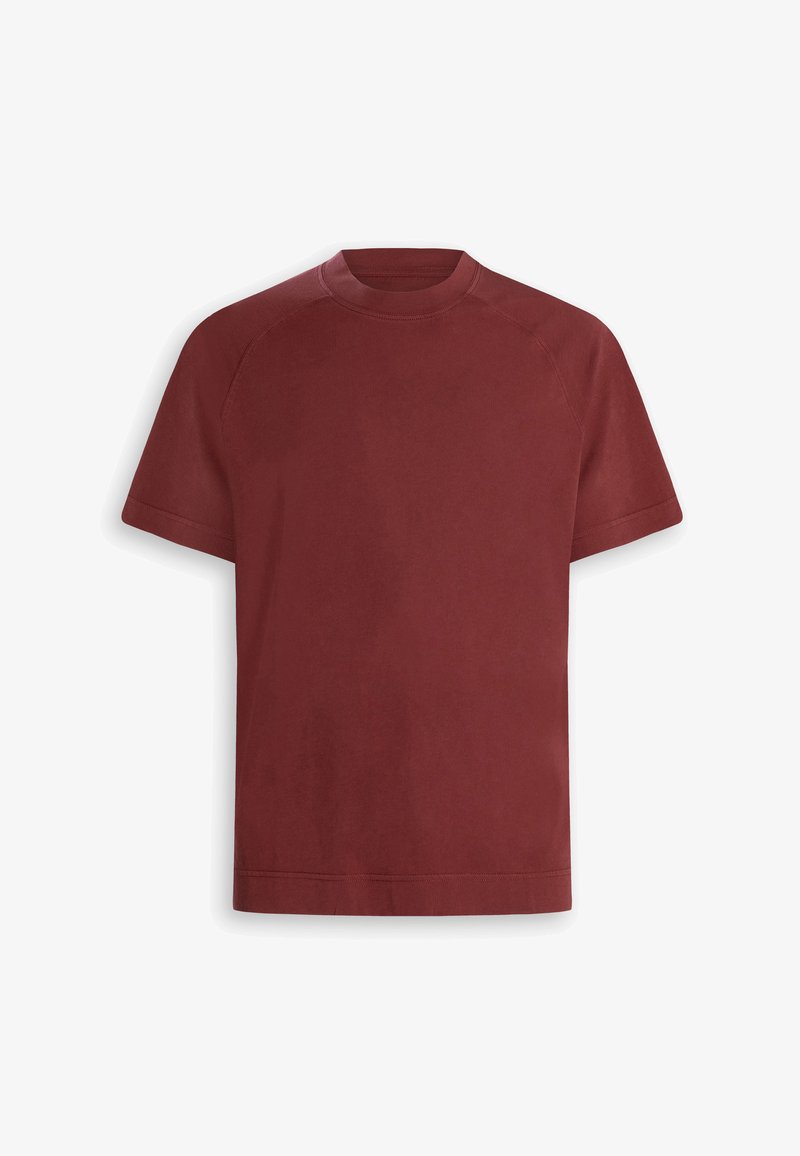 T-shirt à manches courtes avec col rond, de couleur rouge foncé uni, avec manches raglan et ourlet droit.