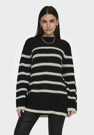Zwart en crèmekleurig gestreept gebreid sweater met lange mouwen, een ronde halslijn en een relaxte pasvorm, met een ribbeltextuur en zijsplitsingen.