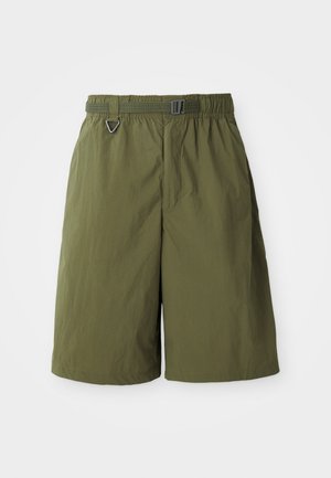 Green nylon shorts with an elastic waistband and adjustable belt. Features a secure metal D-ring and a smooth texture.